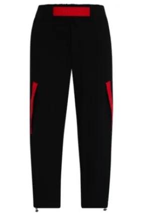 Relaxed-fit tracksuit bottoms with red logo tape