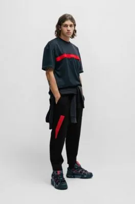 Relaxed-fit tracksuit bottoms with red logo tape